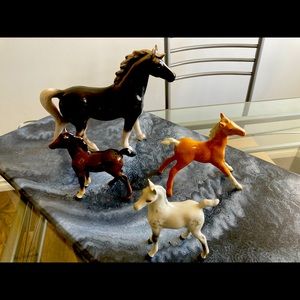 4 ceramic horses by “Beswick in England.